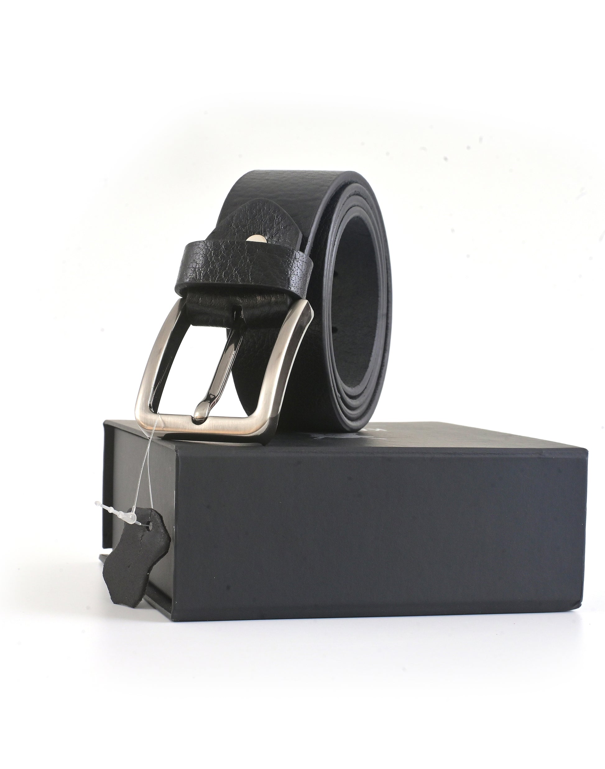 Black leather belt with silver buckle on a black stand against a white background