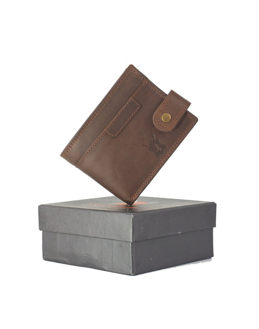 Brown leather wallet on a gray box against a white background